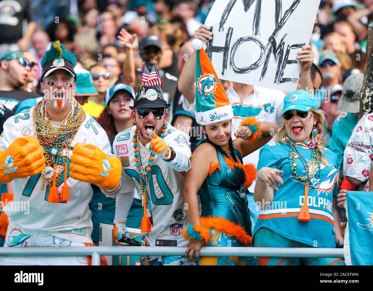 Miami Gardens, USA. 1st Dec, 2019. Miami Dolphins fans pose for the camera during an NFL football game between the Dolphins and Philadelphia Eagles at Hard Rock Stadium in