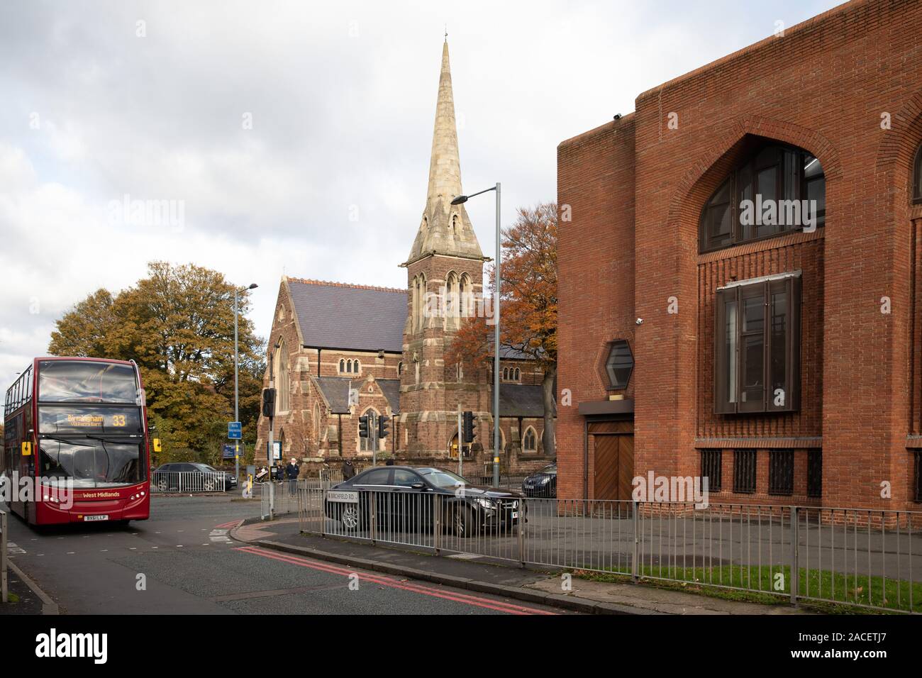 Holy Trinity church and Birmingham Jame Masjid that stand side by side in Trinity Road, Lozells, Birmingham Stock Photo
