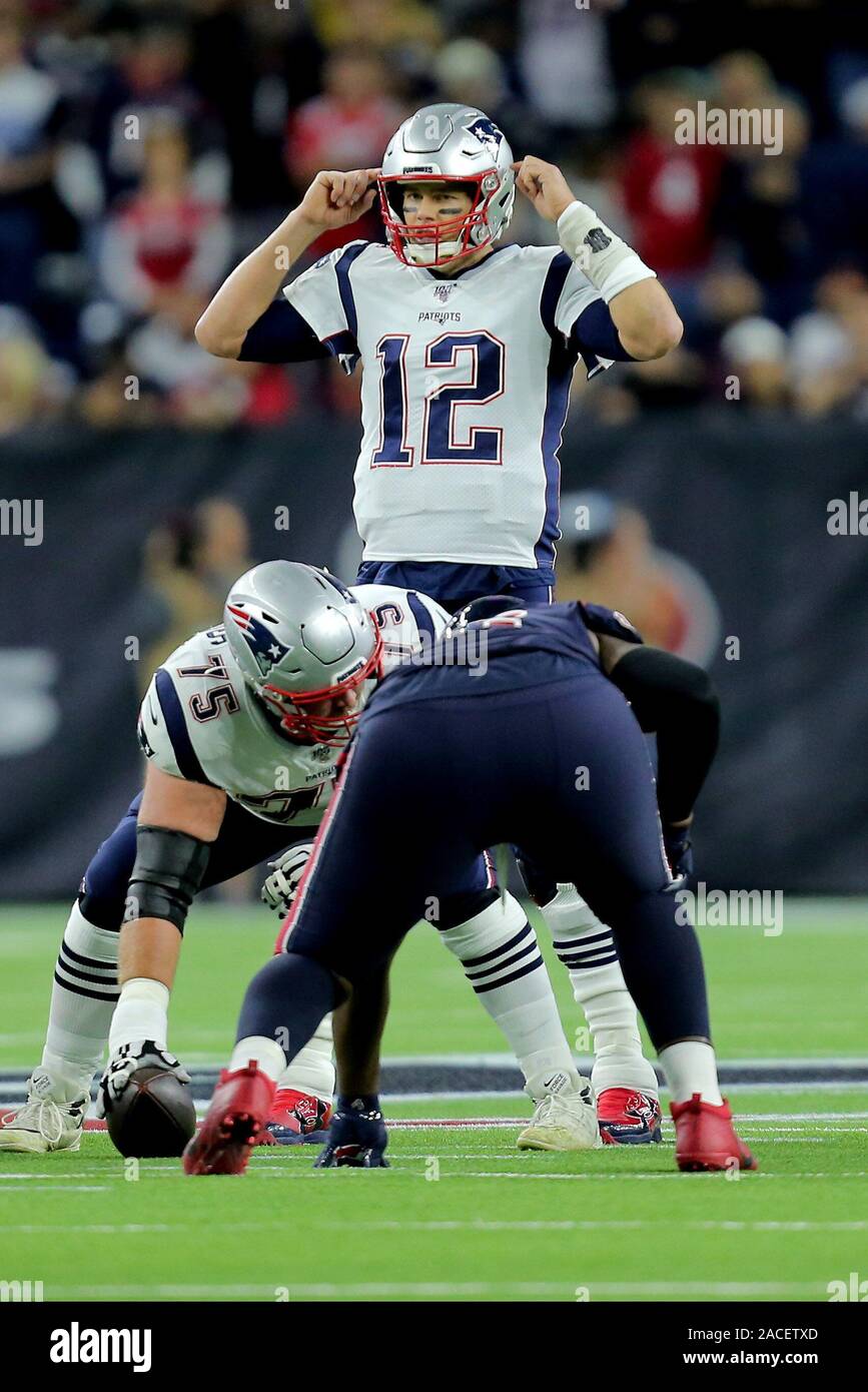 New England Patriot Quarterback Tom Brady (12) signals in the