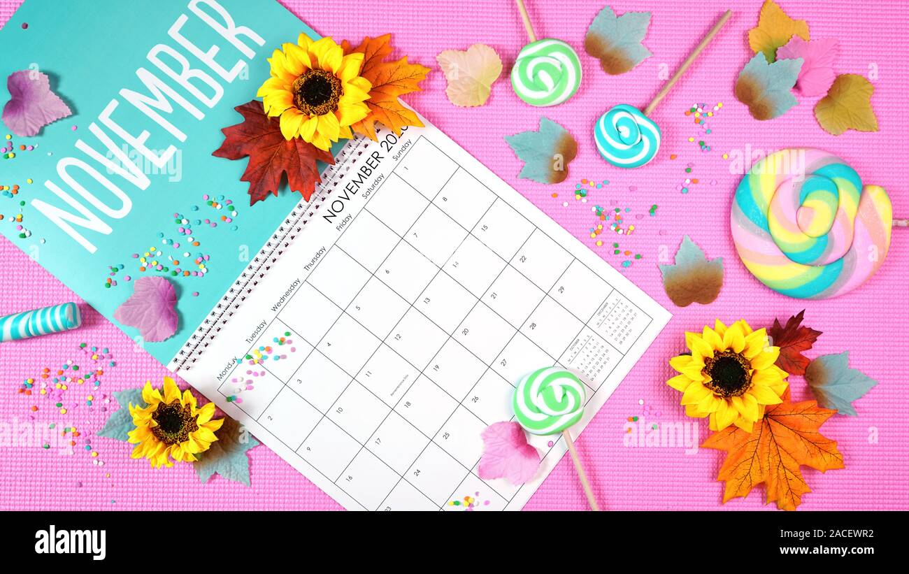 On-trend 2020 calendar page for the month of November modern flat lay with seasonal food, candy and colorful decorations in popular pastel colors. One Stock Photo
