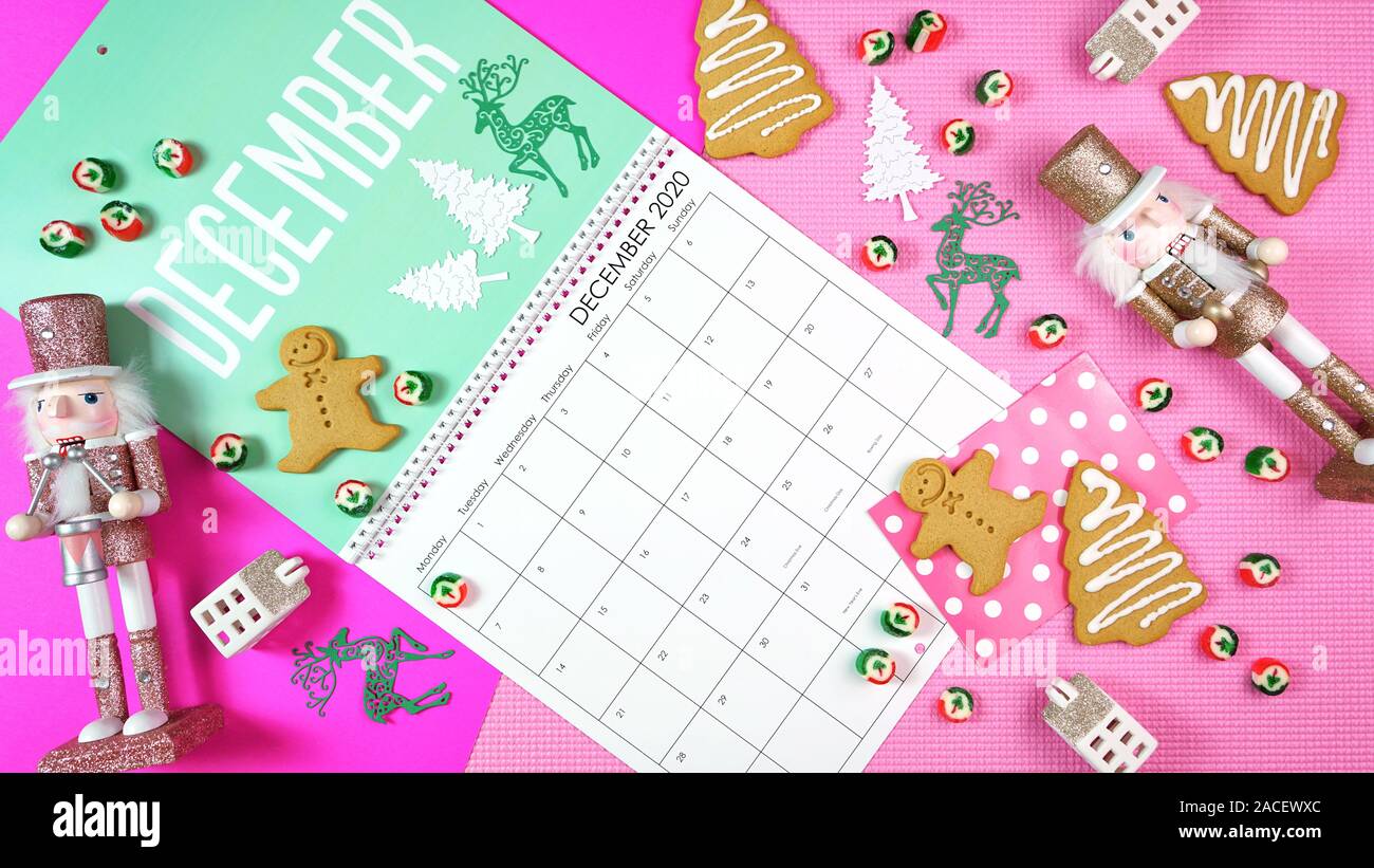 On-trend 2020 calendar page for the month of December modern flat lay with seasonal food, candy and colorful decorations in popular pastel colors. One Stock Photo