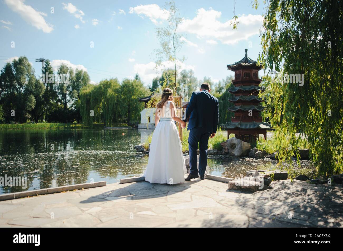 Bride and groom at a photo session in the nature Stock Photo - Alamy