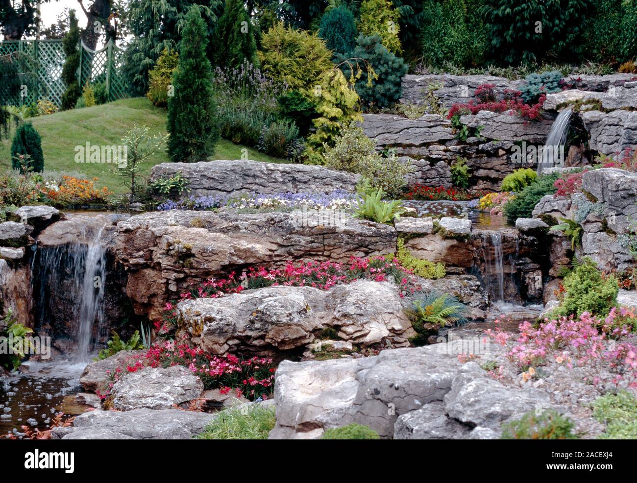 Rockery with cascading stream feature. Large naturalistic rock garden ...