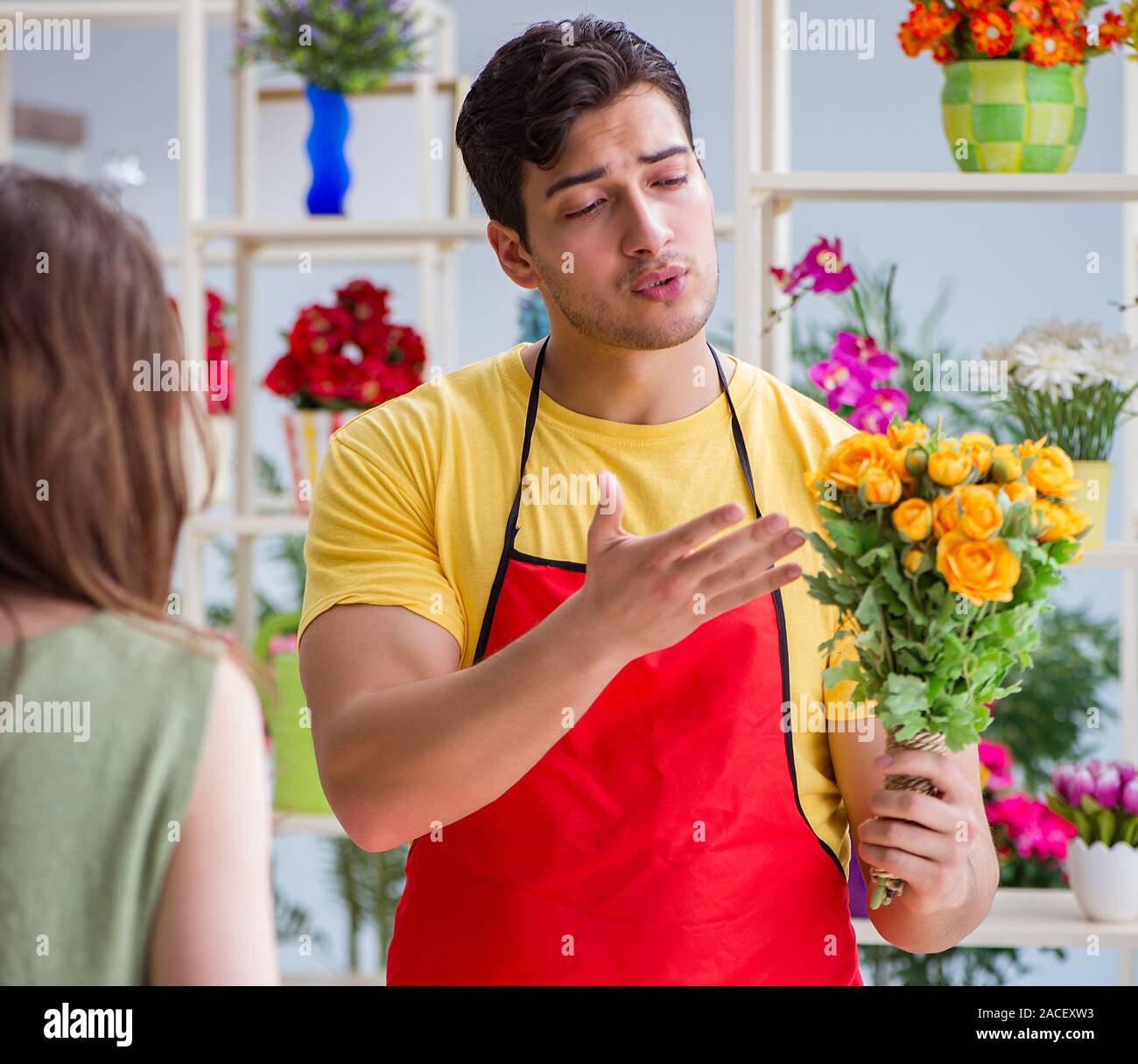 The florist selling flowers in a flower shop Stock Photo Alamy