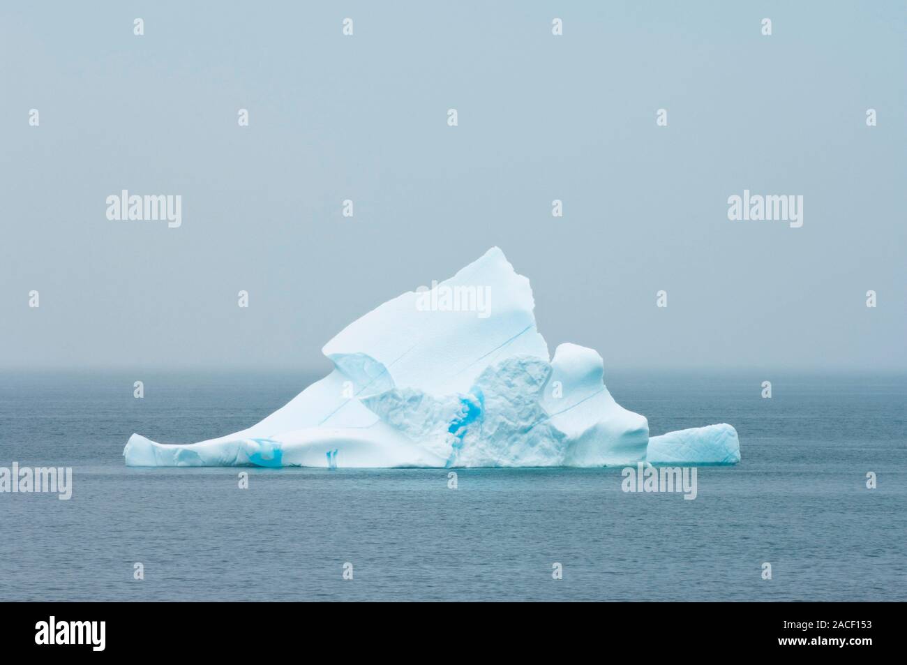 Iceberg in fog. Icebergs are large pieces of freshwater ice that have