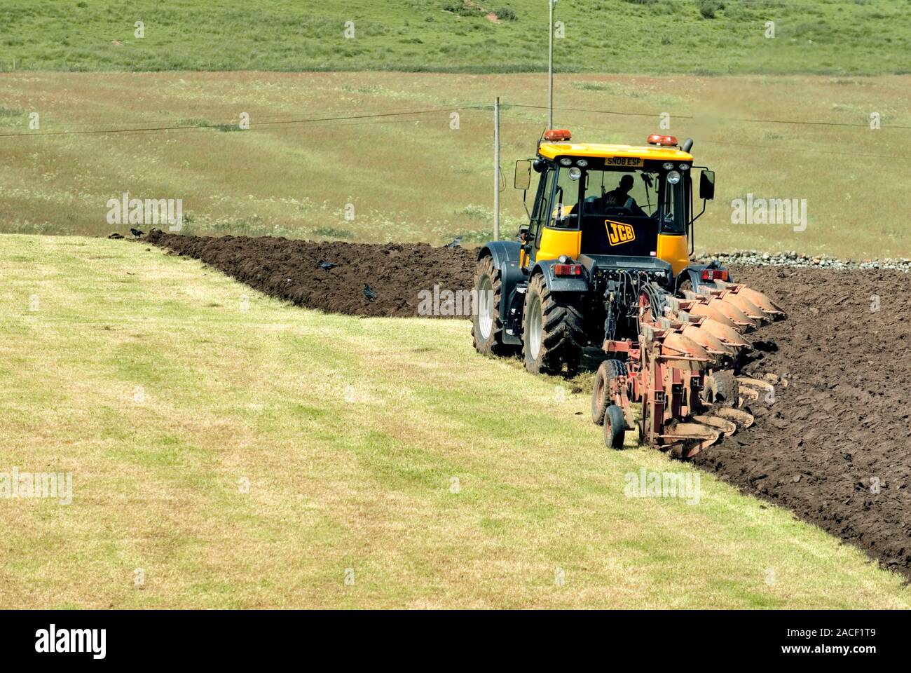 Tractor ploughing a field. Photographed in Northumberland National Park ...