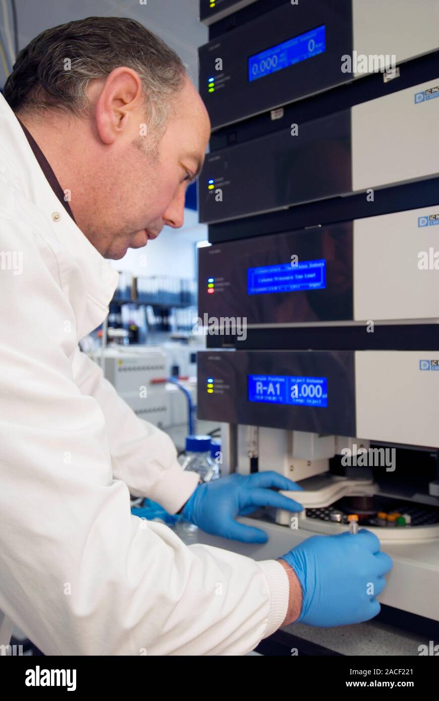 Liquid chromatography. Researcher placing protein samples in a nano