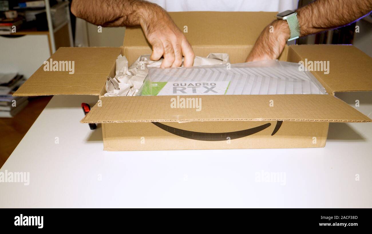 Paris, France - Mar 11, 2019: Curious man unboxing unpacking from Amazon  Parcel new Nvidia Quadro RTX 5000 for workstations running professional  CAD, CGI, DCC application software video card GPU Stock Photo - Alamy
