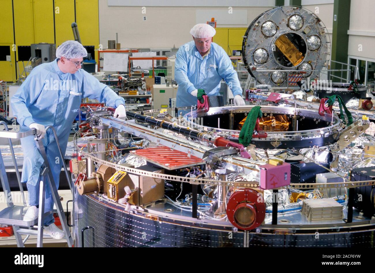 Satellite Buildcon Cluster satellite construction. Engineers assembling and constructing ...