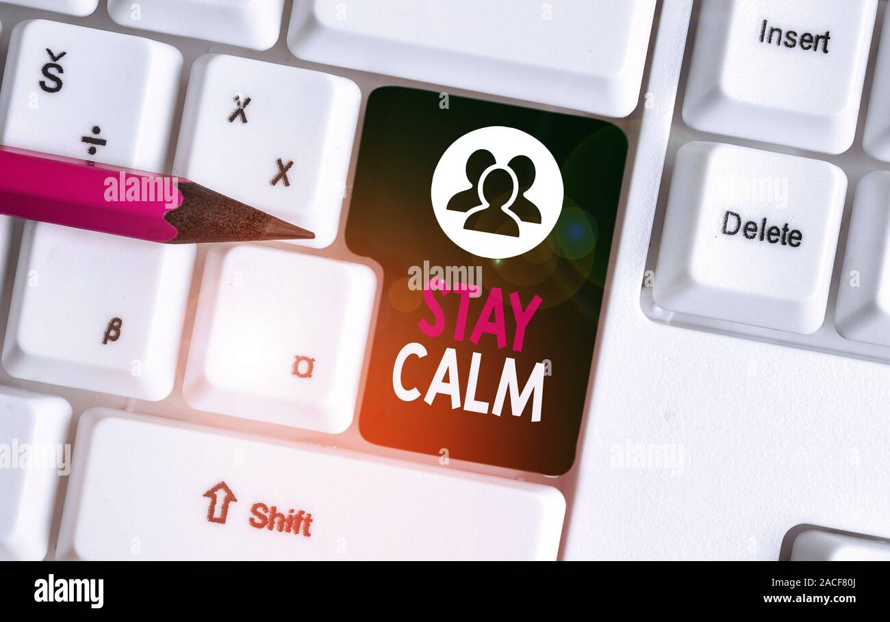 Text sign showing Stay Calm. Business photo text Maintain in a state of motion smoothly even under pressure White pc keyboard with empty note paper ab Stock Photo