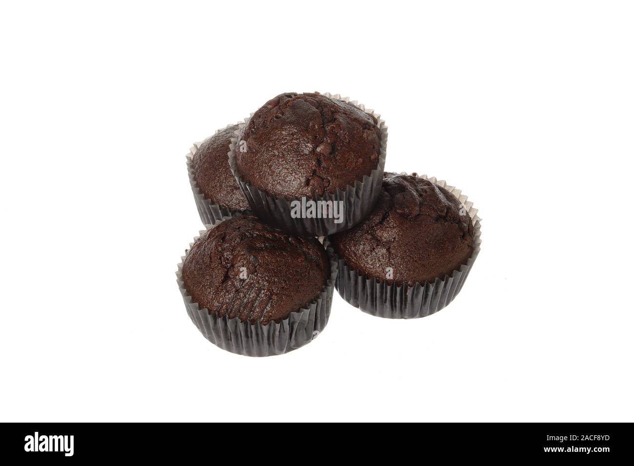 Four chocolate muffins isolated on white. Stock Photo