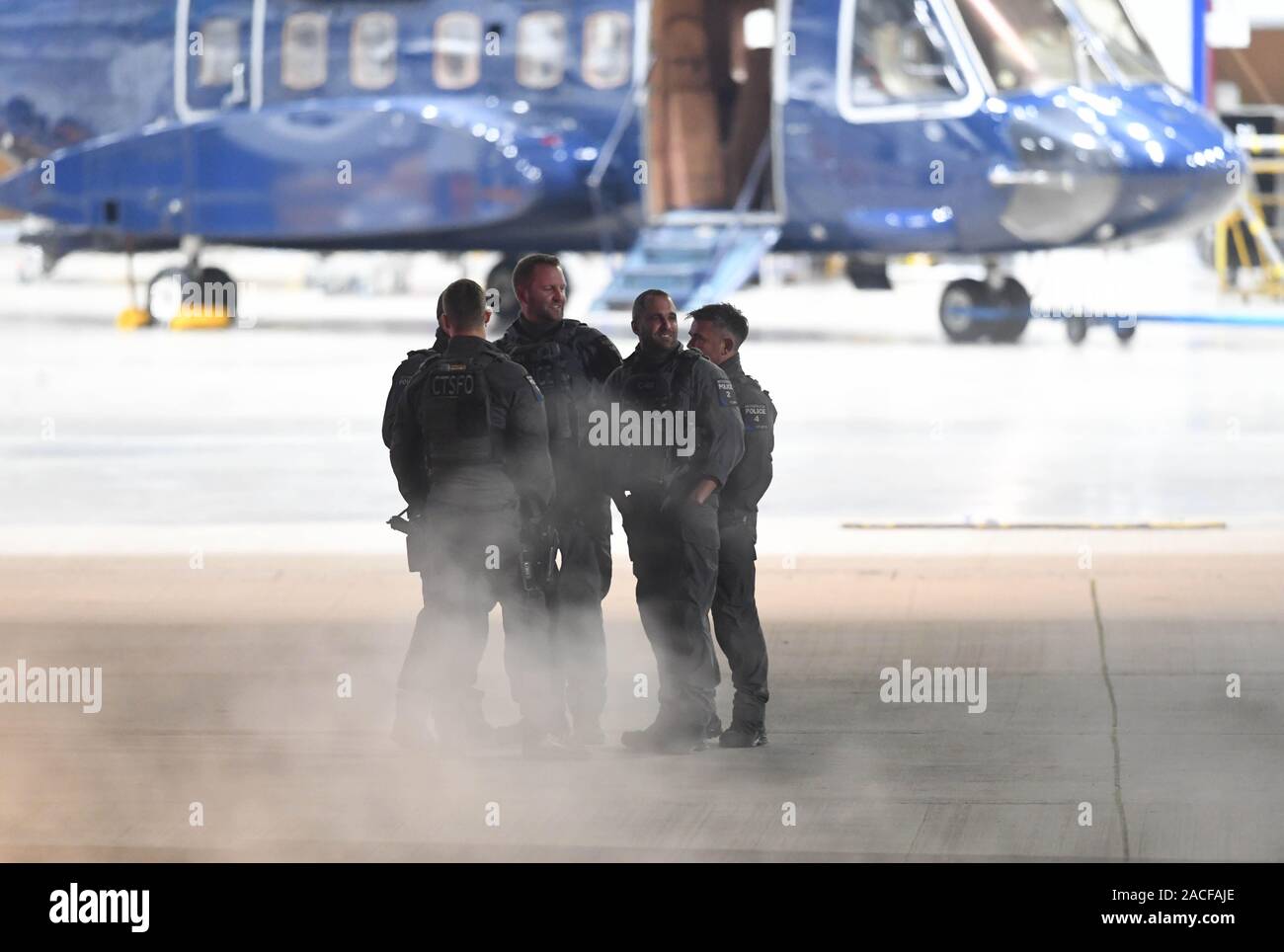 Counter Terrorist Specialist Firearms Officer of the Metropolitan Police await the arrival of US President Donald Tump and his wife Melania, at Stanstead Airport, London, ahead of the NATO summit, on the first day of his visit to the United Kingdom. Stock Photo