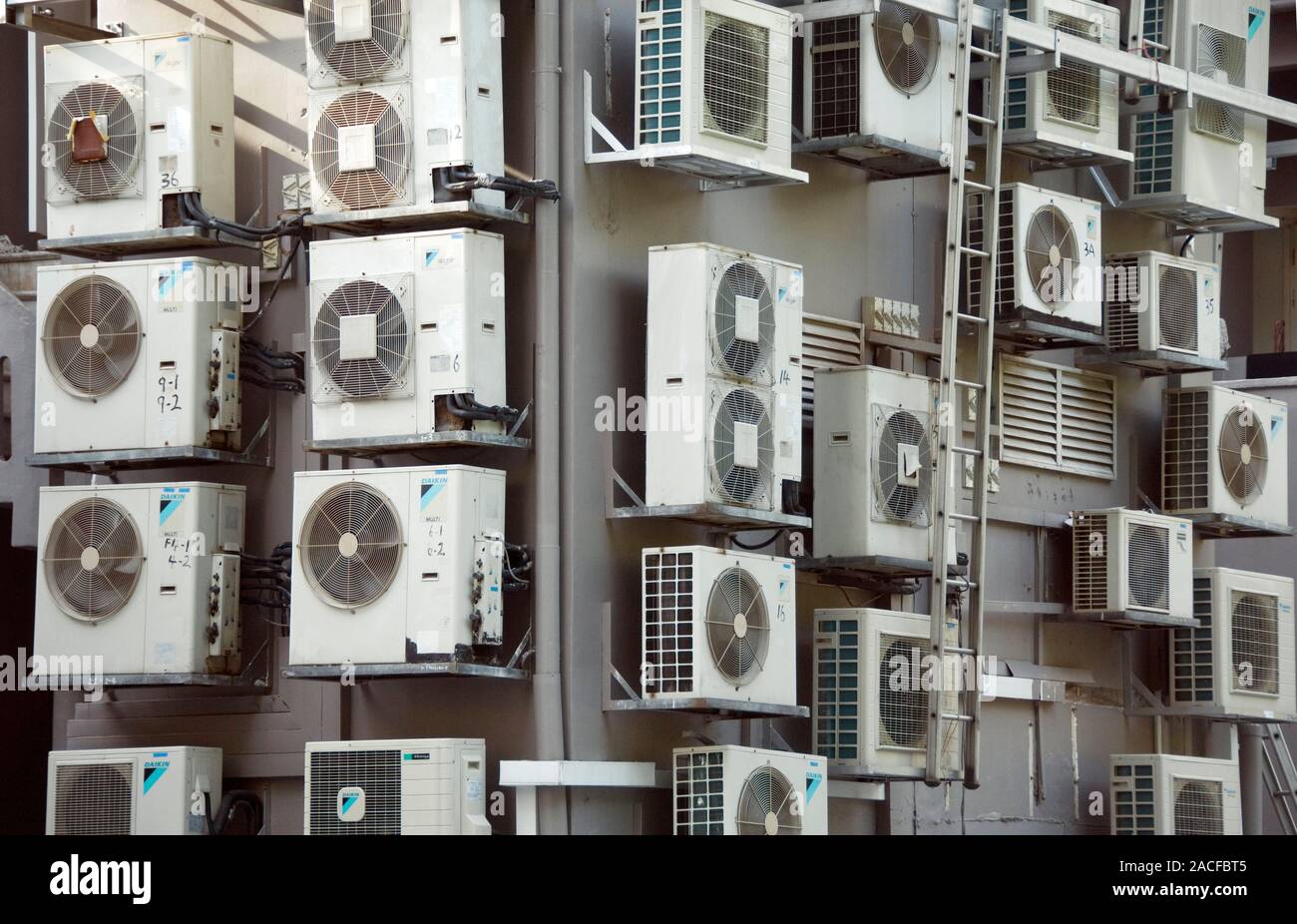 Air conditioning units mounted on the outside of a building Stock Photo