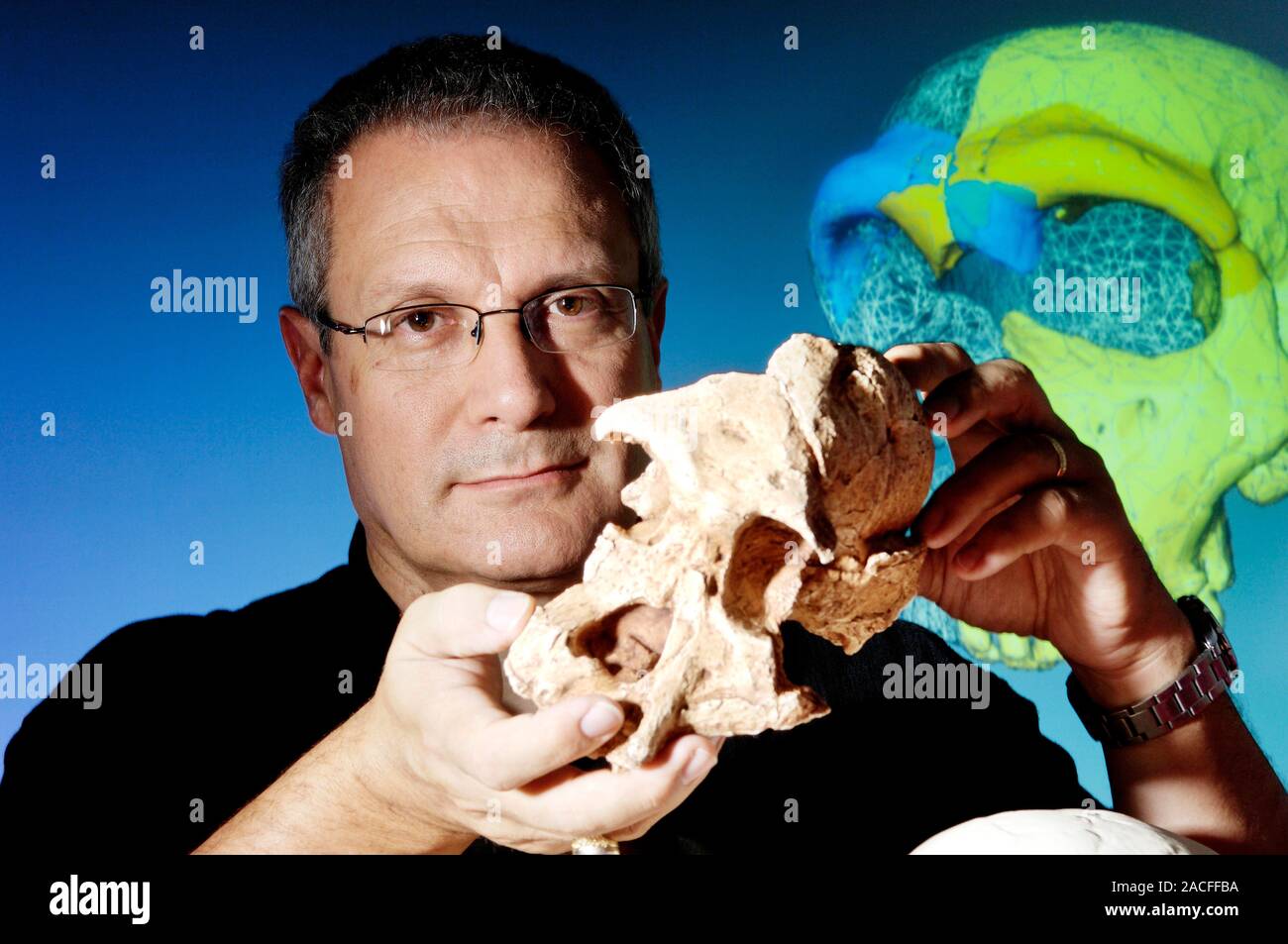 Jean-Jacques Hublin (born 1953), French anthropologist, holding a fossil ho...