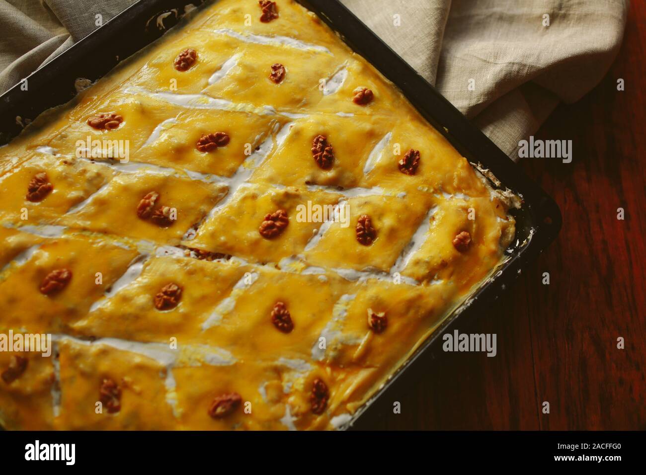 Homemade baklava with pistachios and hazelnuts and honey syrup Stock