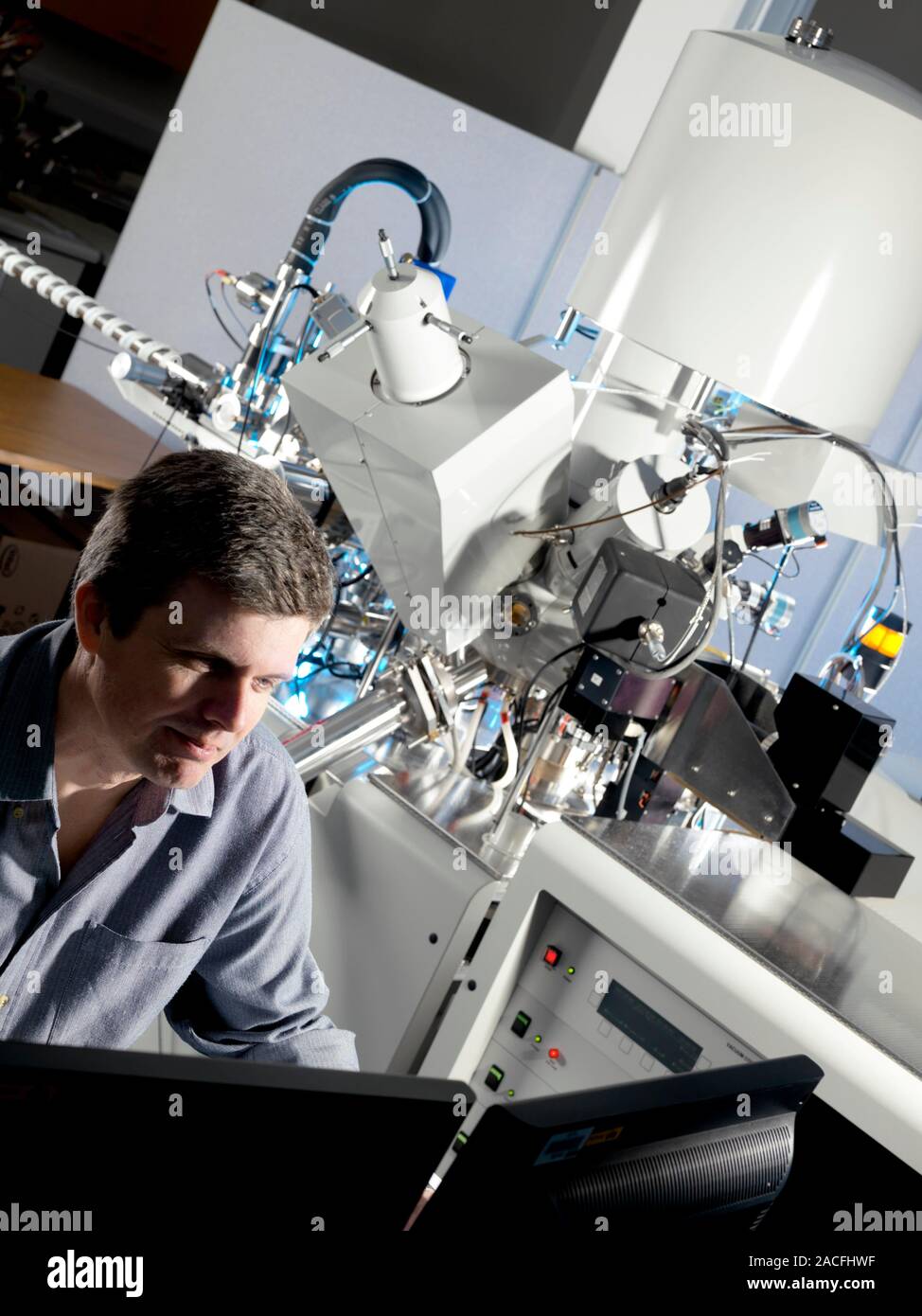 Xray materials analysis equipment. Researcher adjusting the controls