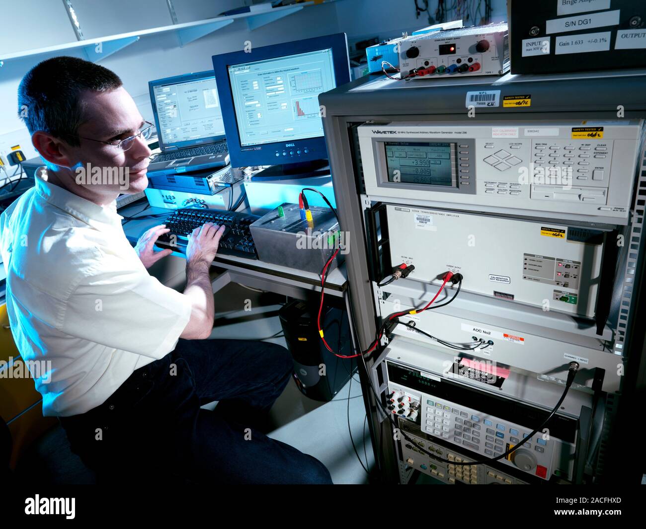Calibrating electrical analysis equipment. Researcher calibrating a