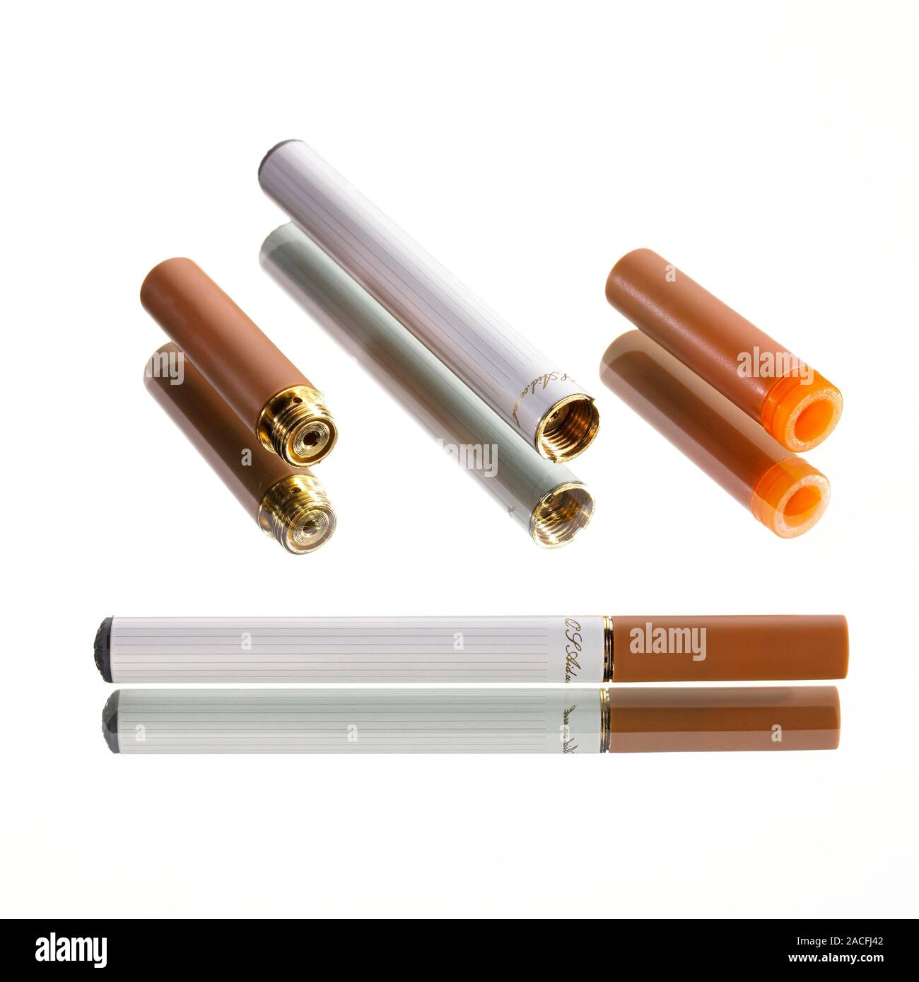 Electronic cigarette. E-cigarette assembled (bottom) and disassembled  (top). Top from left: vapouriser (gold) fitted with a nicotine cartridge  (brown Stock Photo - Alamy