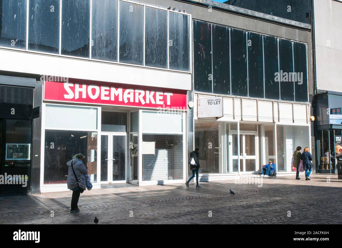 Empty shops showing the desolation of the High Street. Shops are