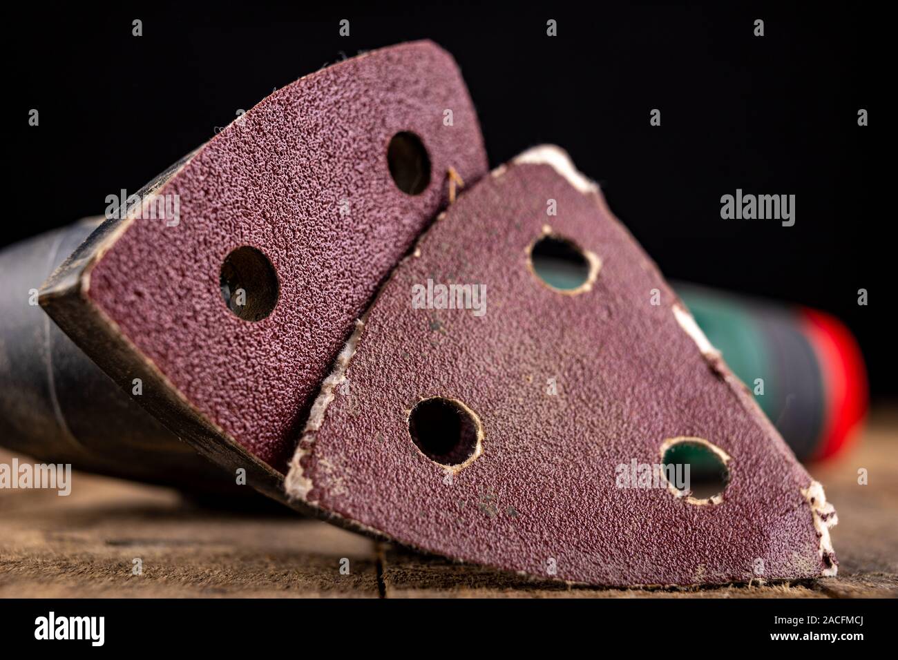 Changing sandpaper in a rotary wood grinder. Work tool in a carpentry