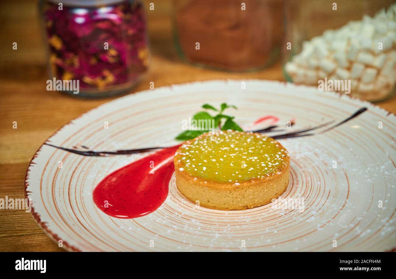 Delicious lemon tart with raspberries dressing Stock Photo