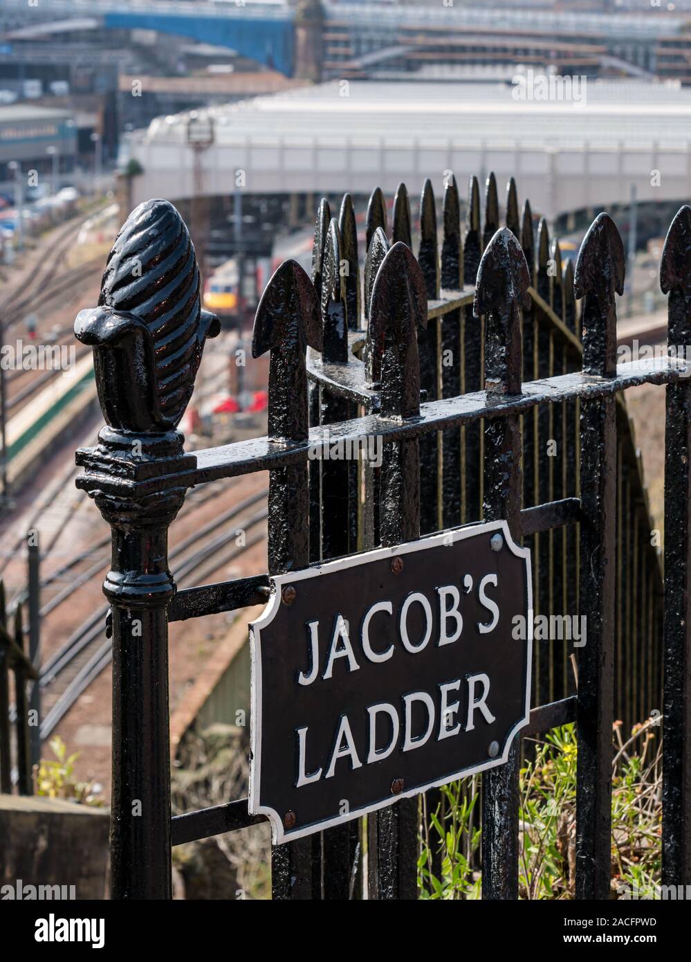 Jacob's Ladder steps sign on railings with Waverley railway station