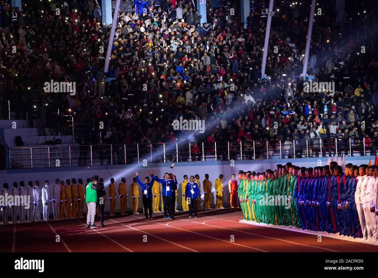 Nepal national players take a part in torch relay during the