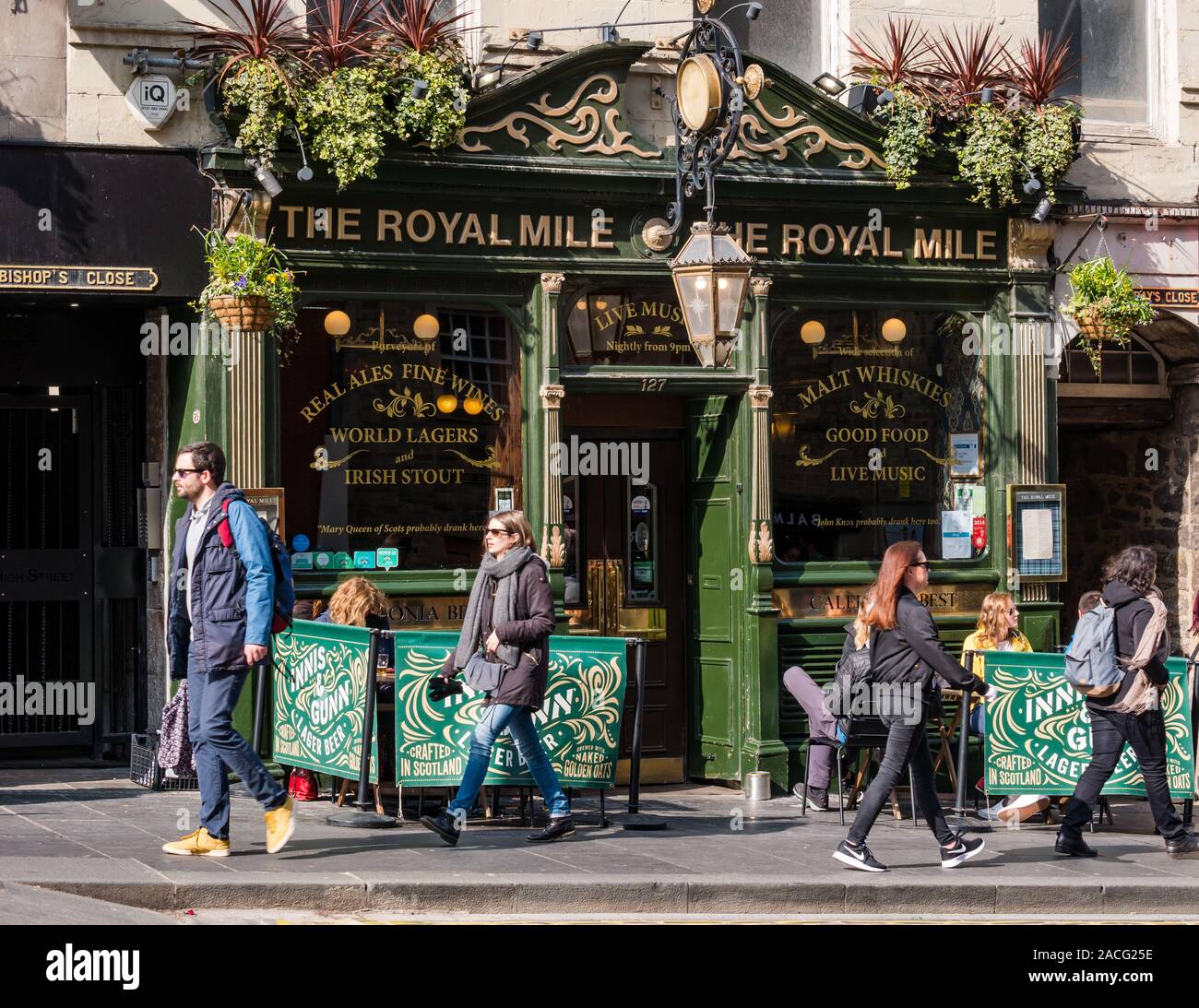 The Royal pub with pavement tables and people walking past  in sunshine,  Edinburgh, Scotland, UK Stock Photo