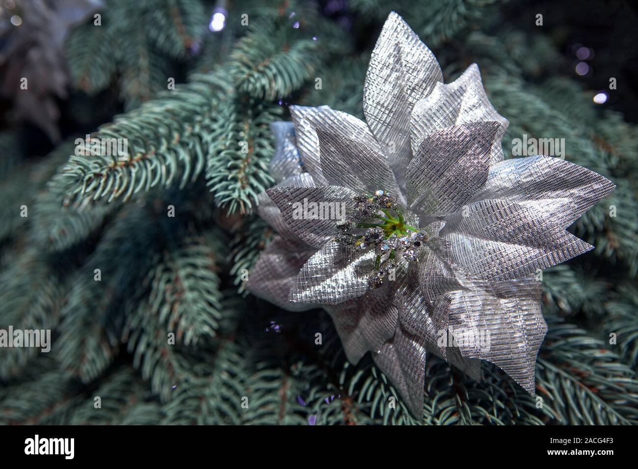 silver decorative flower on the Christmas tree Stock Photo