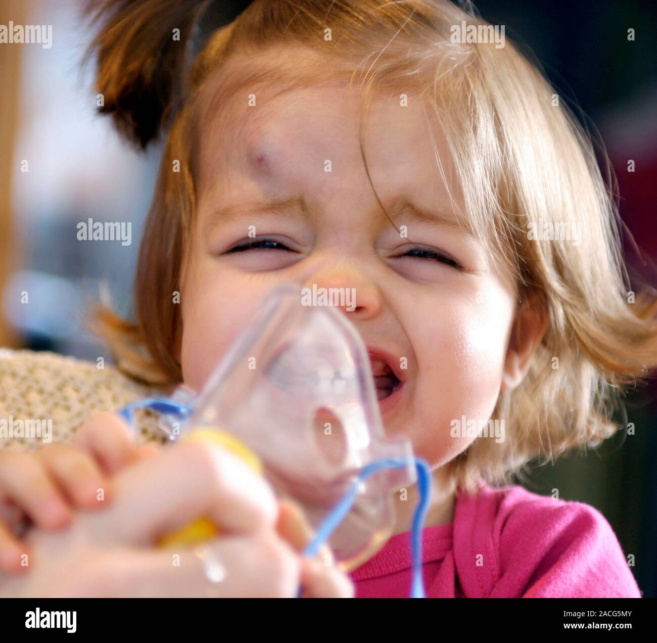 Oxygen therapy. Young girl receiving oxygen therapy at home. Oxygen