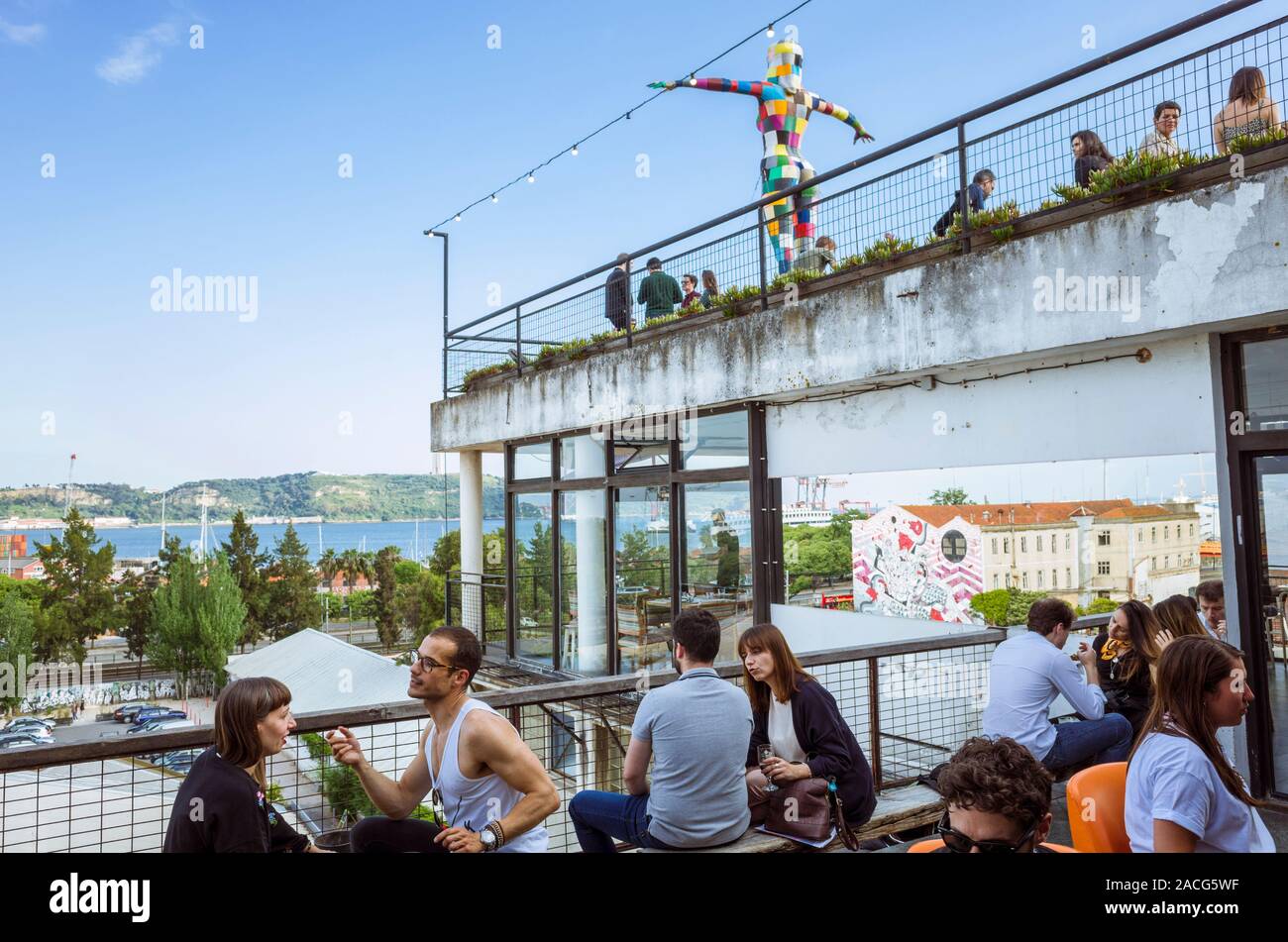 Lisbon, Portugal Young people enjoy at the Rio Maravilha rooftop bar