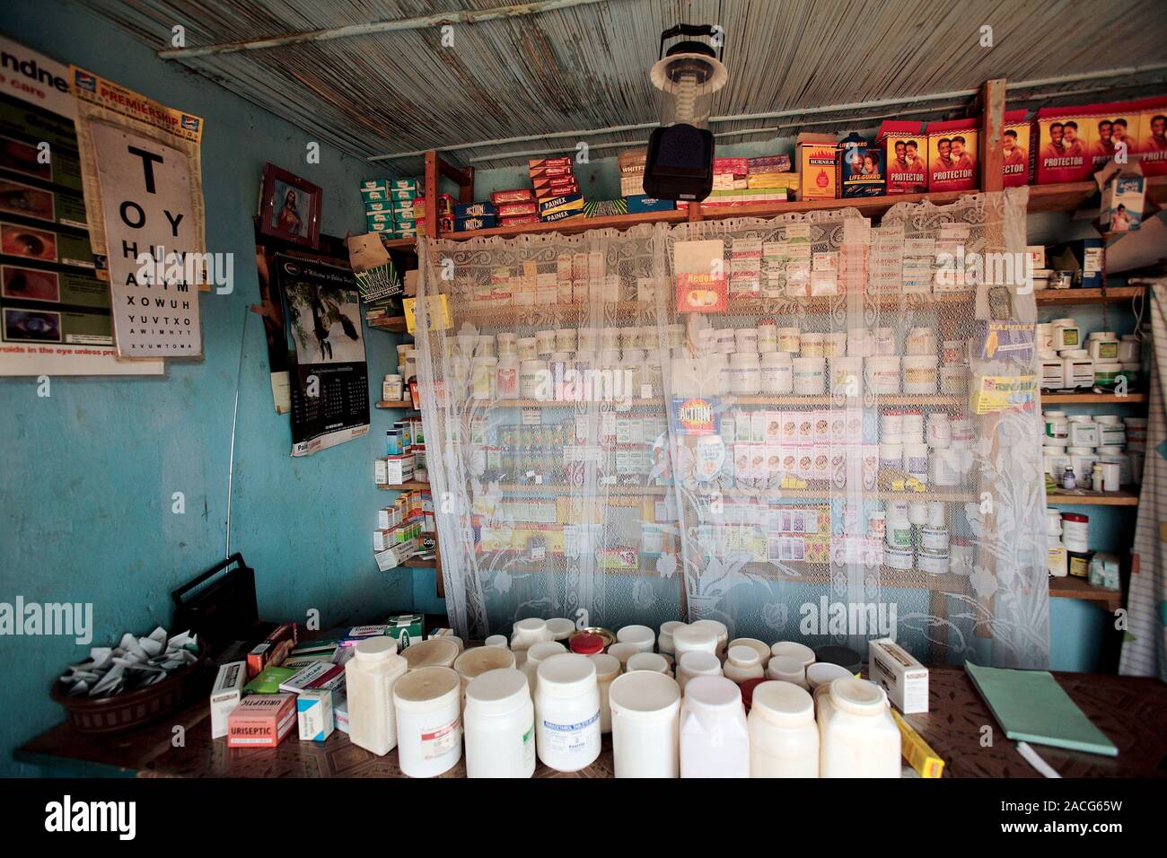 Rural pharmacy, Uganda. An array of drugs and other medical products is