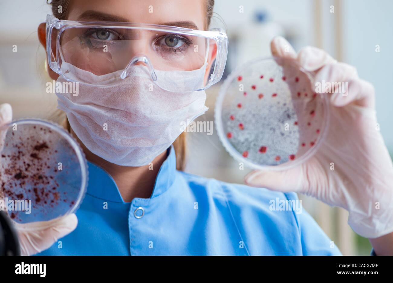 Female scientist researcher conducting an experiment in a laboratory ...
