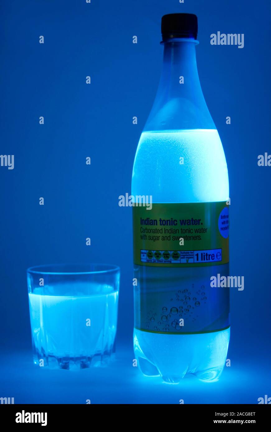 Tonic water in UV light. Tonic water contains quinine which fluoresces