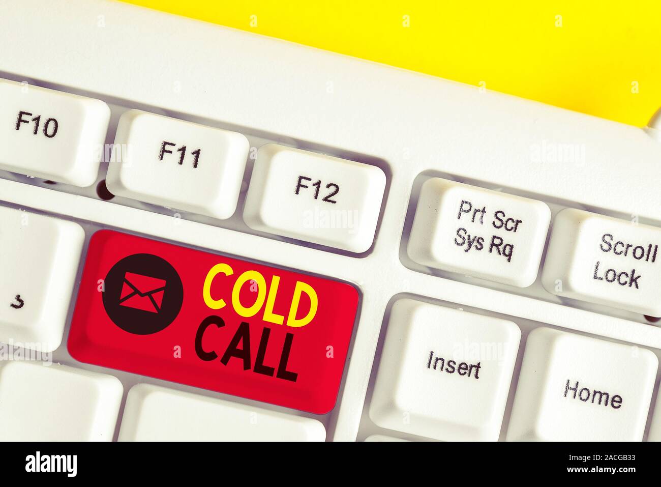 Text sign showing Cold Call. Business photo text Unsolicited call made by someone trying to sell goods or services White pc keyboard with empty note p Stock Photo