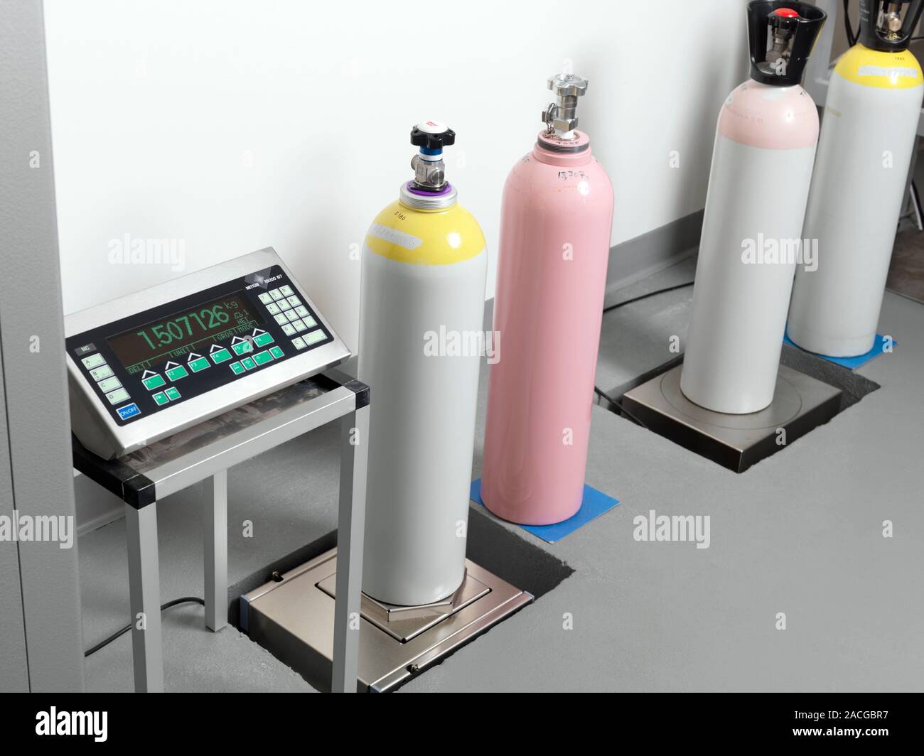 Weighing gas cylinders. Gas cylinder being weighed on scales. The