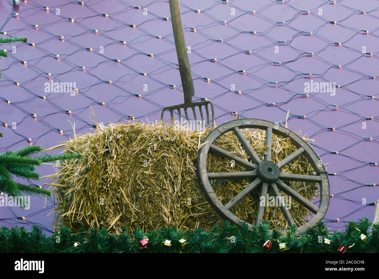 Pitchfork Christmas 2022 Antique Pitchfork And Wooden Wheel Hub On A Hay Stack. Decoration On A  German Christmas Market Stock Photo - Alamy
