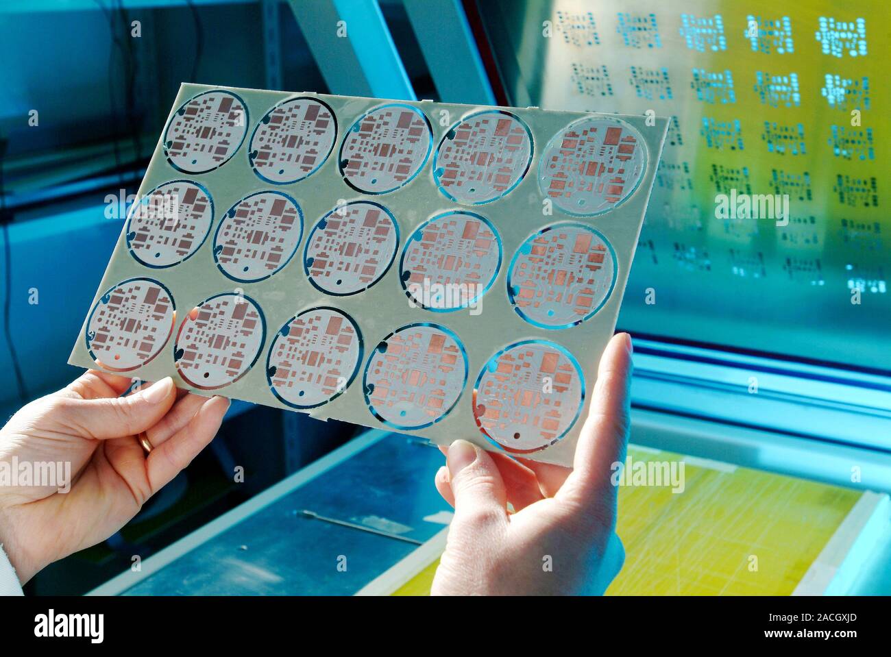LED street lighting. Technician holding a printed circuit board (PCB