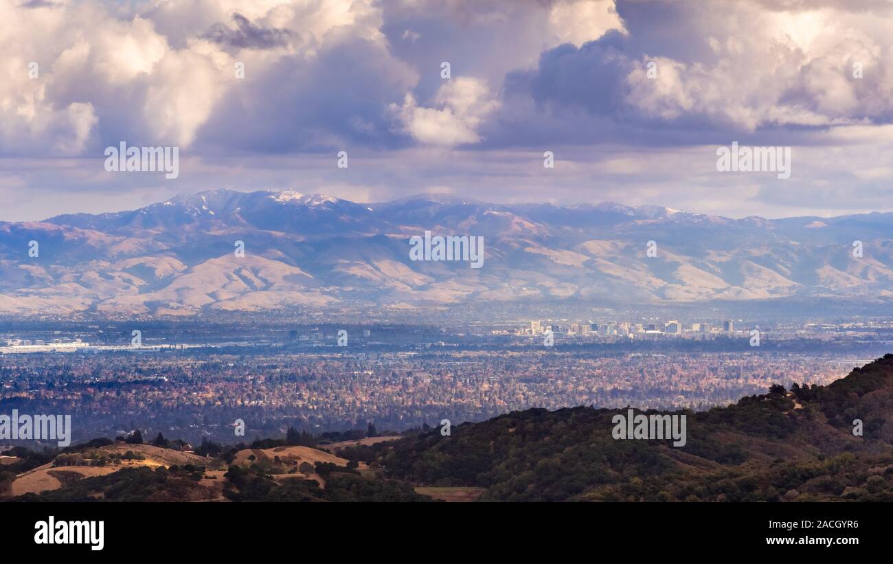 Aerial view San Jose, part of Silicon Valley; snow is visible on top of Mount Hamilton (part of Mount Diablo mountain range); storm clouds cover the s Stock Photo