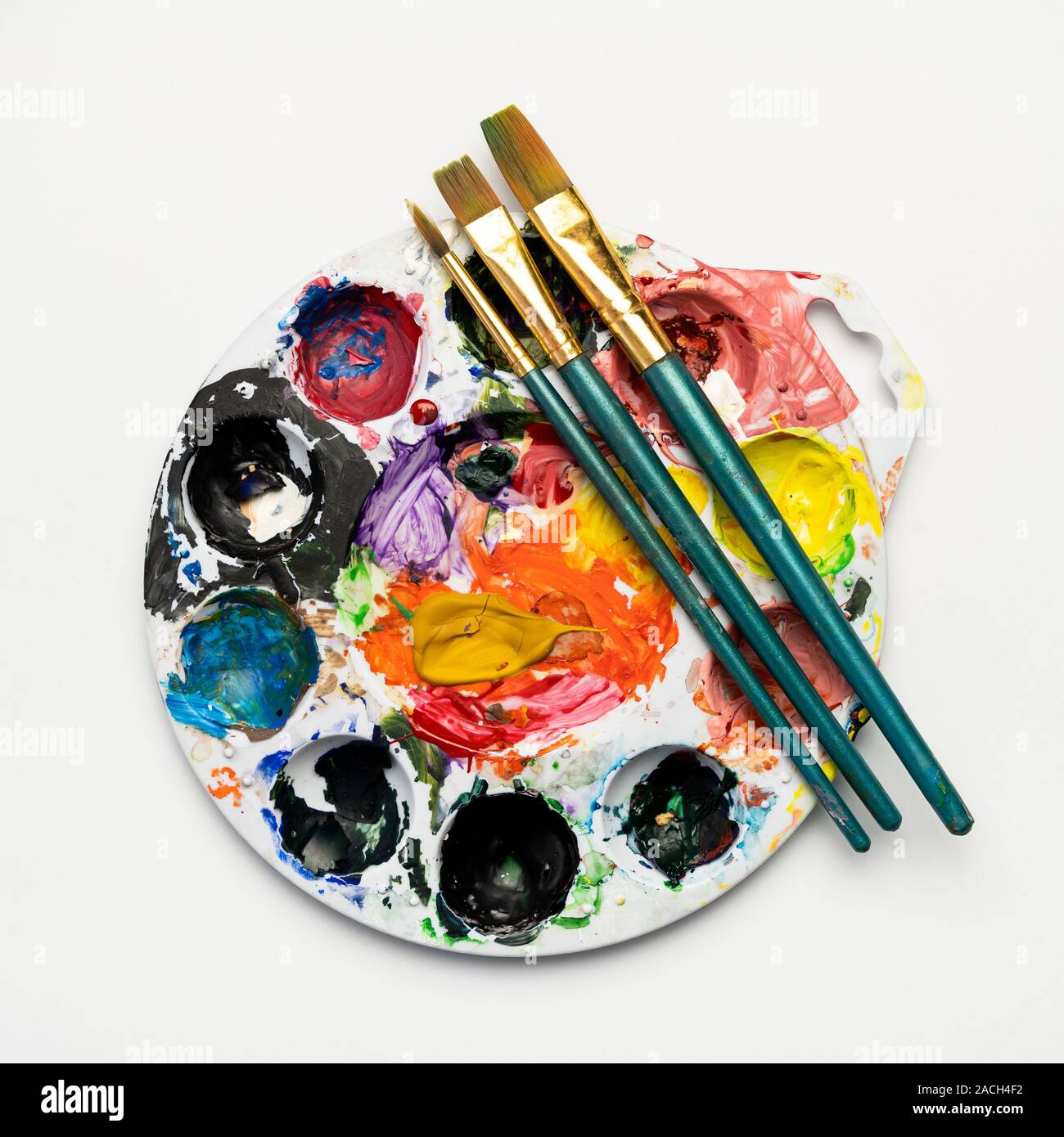 Color mixing plate and paintbrushes Stock Photo