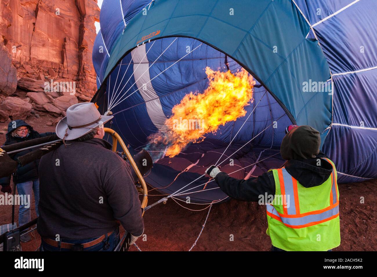 A hot air balloon fills with hot air from a buner in preparation for launch in the Monument Valley Balloon Festival in the Monument Valley Navajo Trib Stock Photo