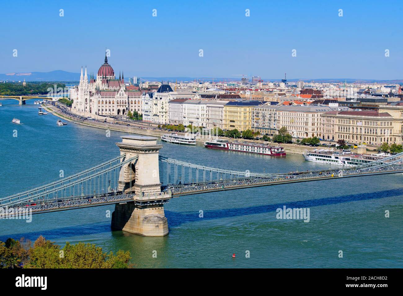 Panorama of Hungarian Parliament Building, Széchenyi Chain Bridge, and River Danube in Budapest, Hungary Stock Photo