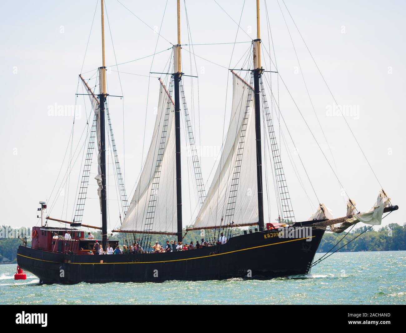 Three-masted tall ship Kajama schooner sailing on Lake Ontario, carrying passengers. Stock Photo