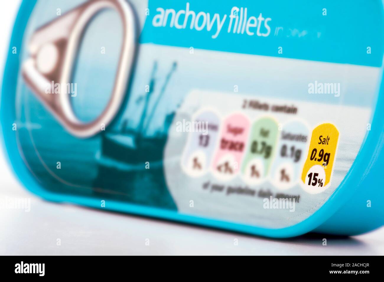 Nutritional information. Tin of anchovy fillets with a coloured