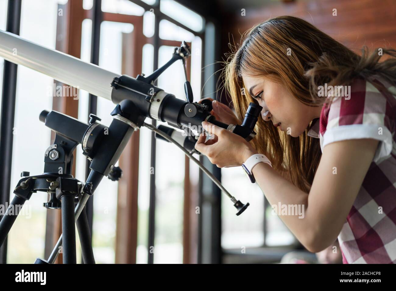 Watching stars through telescope discovery hires stock photography and
