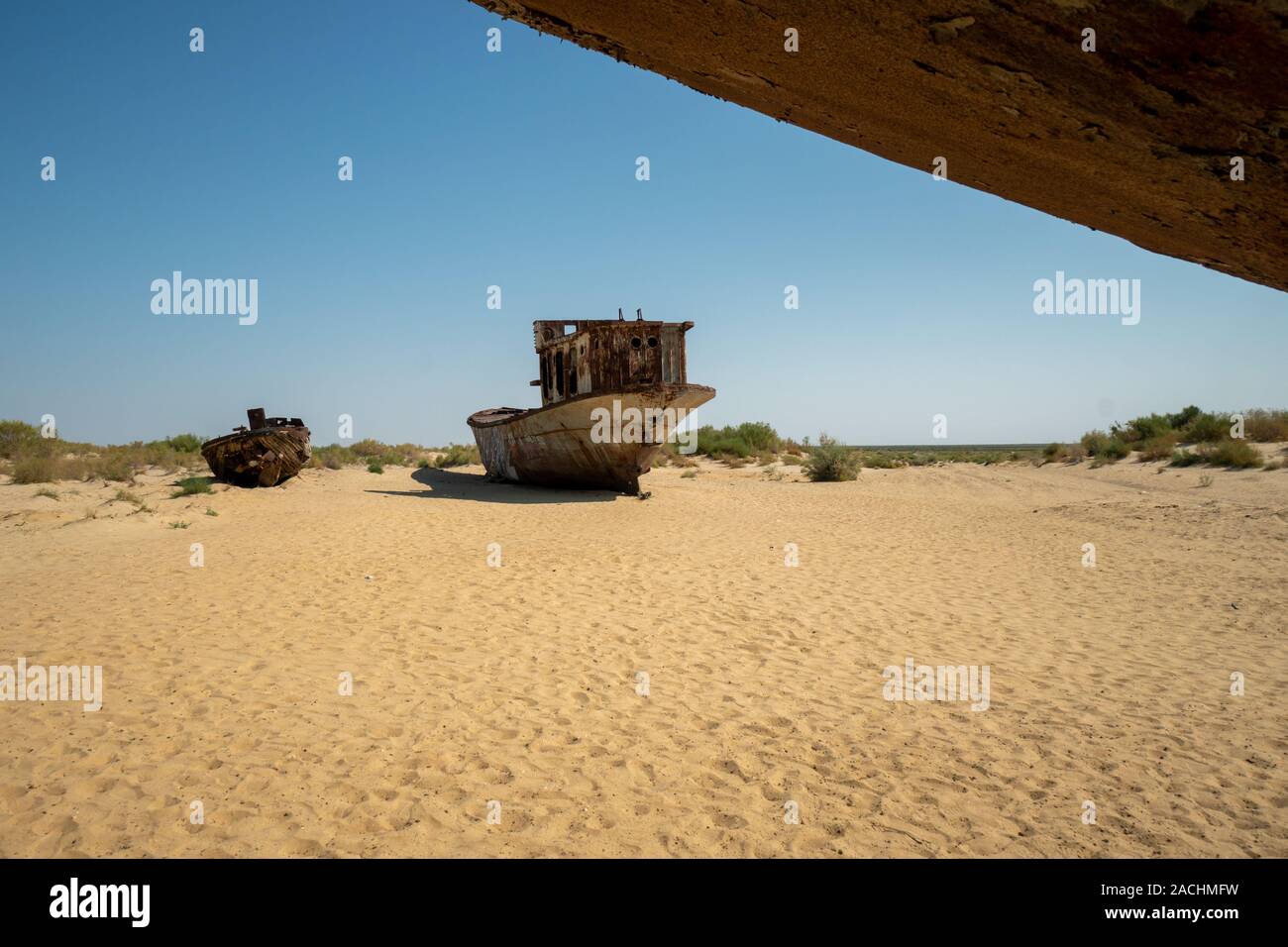 Rusty ship wreck in the deserted Aral Sea near Muynak in Uzbekistan Stock Photo