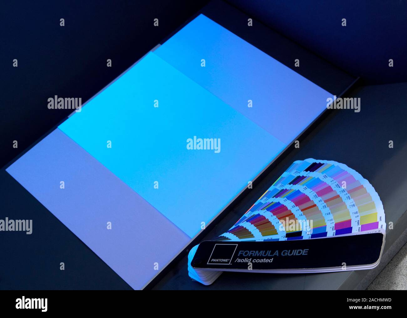 Paper quality. White paper and colour charts under ultraviolet (UV