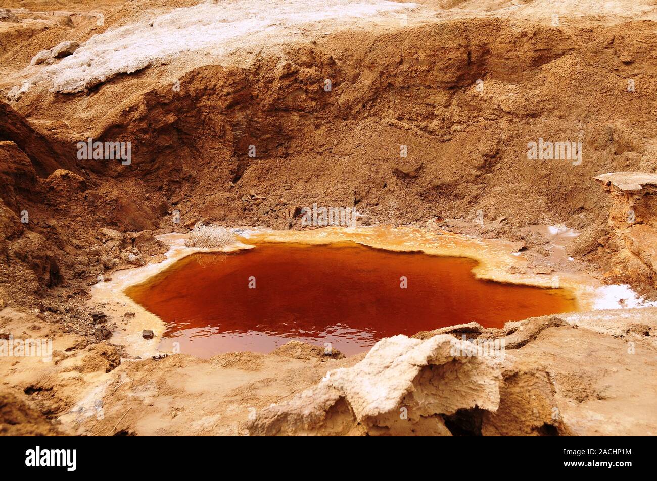 A sinkhole caused by the receding water level of the Dead Sea ...