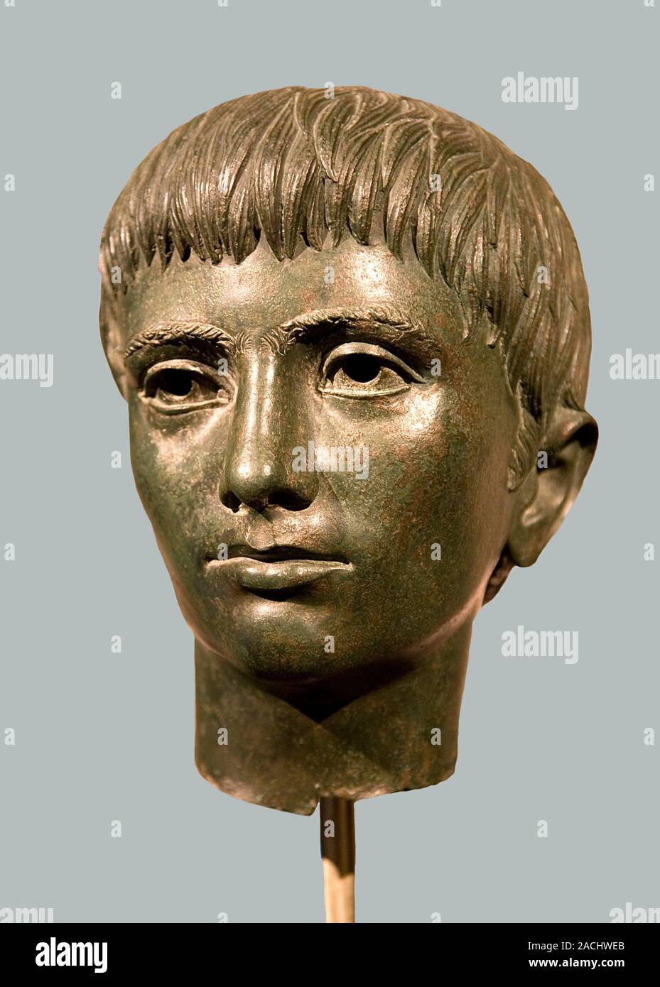 Hollow bronze head of a young man made circa 330 BC. The head formed ...