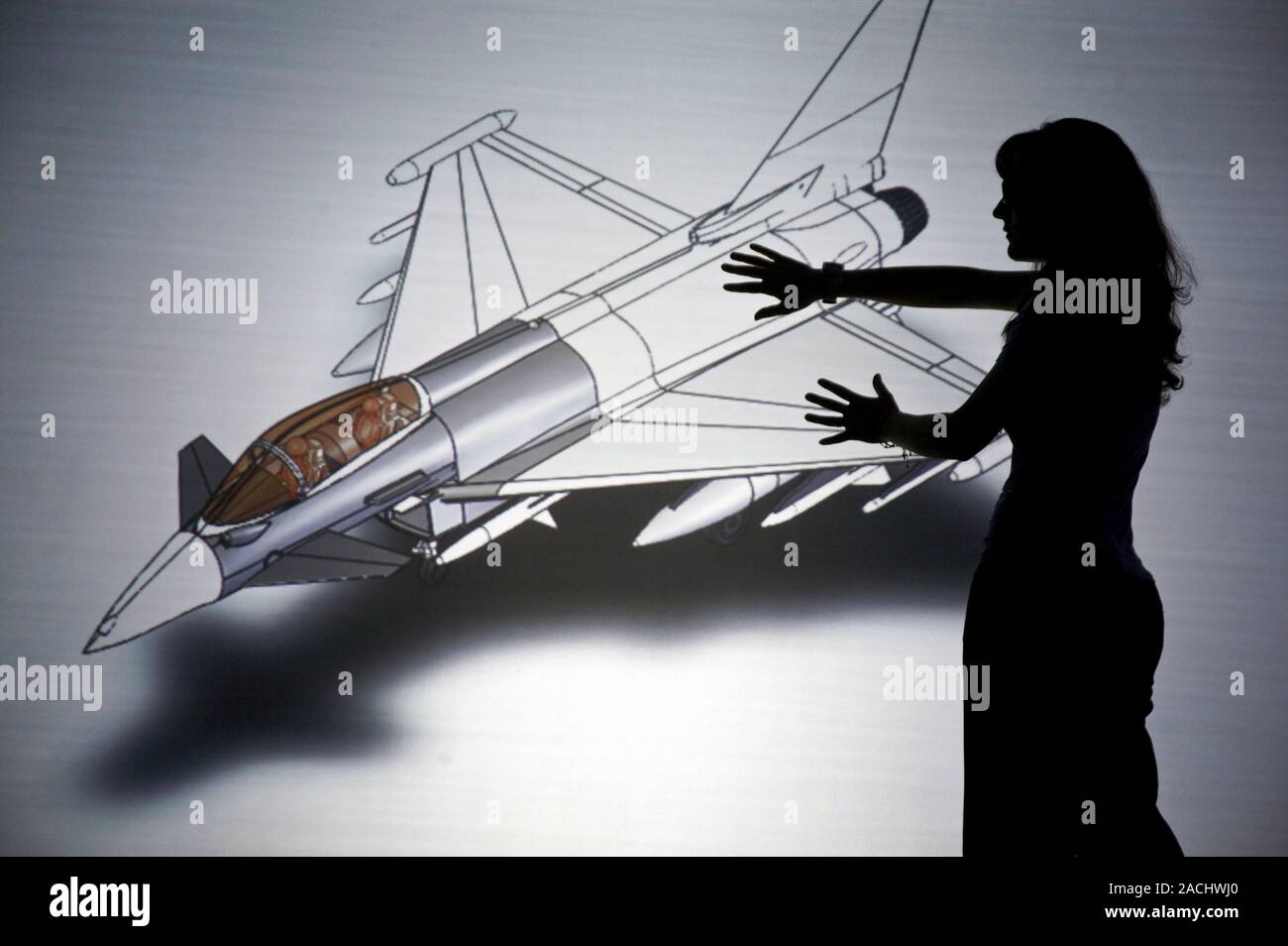 Aeroplane design. Researcher using virtual reality to design a fighter ...